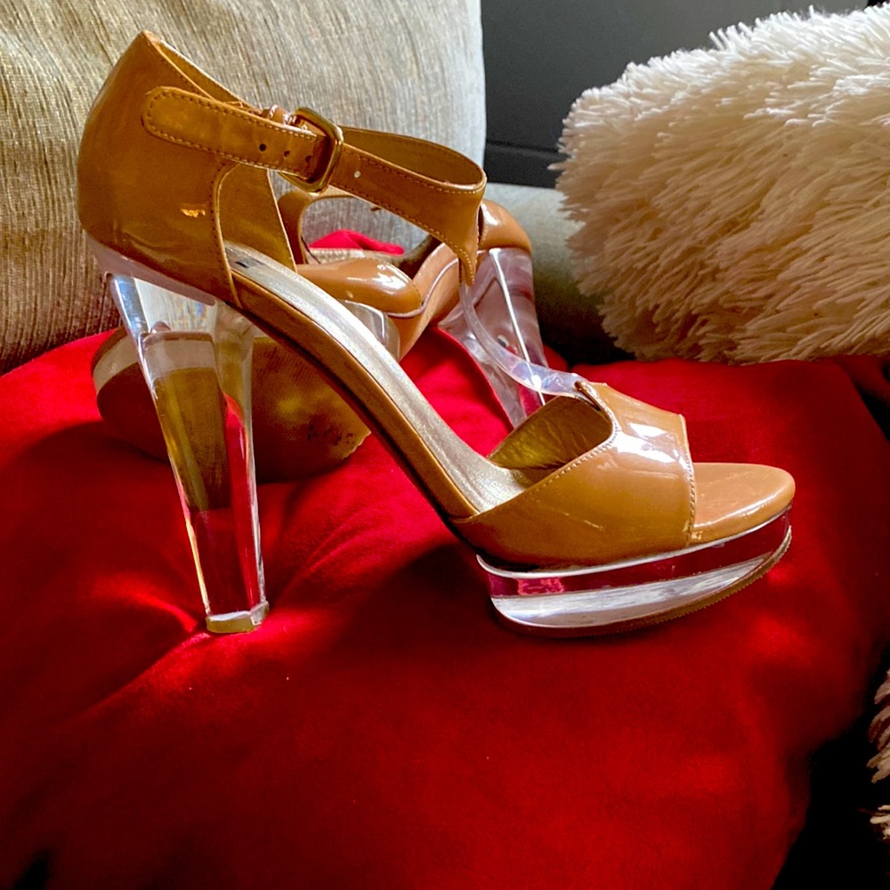 Stuart Weismann clear with tan buckle and detail, peek toe platforms.